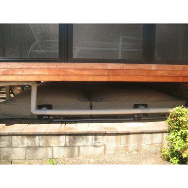 Pair of Bladders installed under deck to collect rainwater
